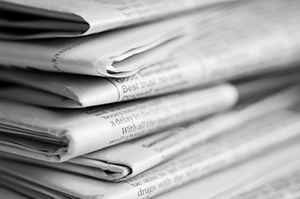 Stack of folded newspapers